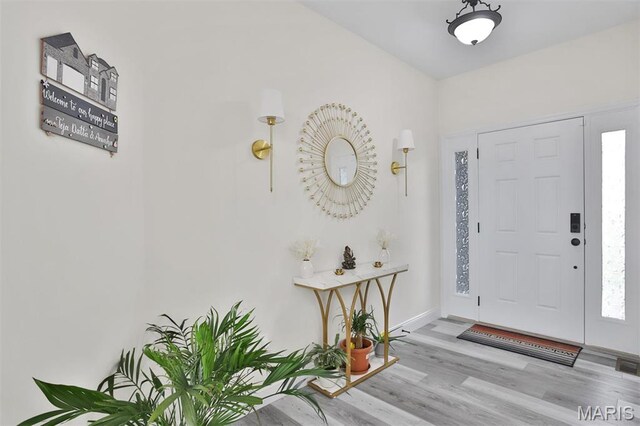 112 Westhaven View Dr, Wentzville, MO 63385 - entryway featuring wood finished floors and baseboards