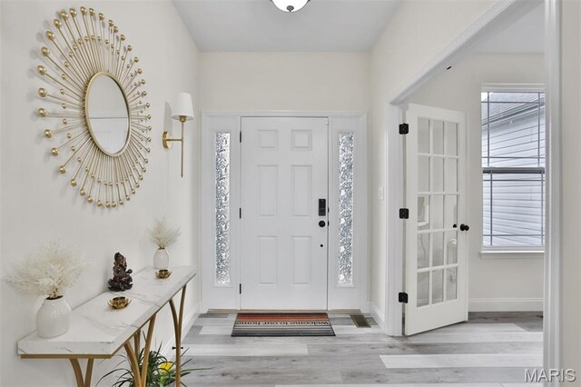 112 Westhaven View Dr, Wentzville, MO 63385 - entryway featuring wood finished floors and baseboards