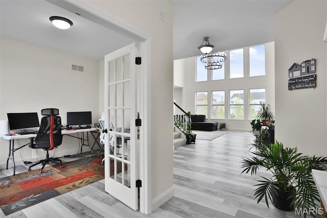 112 Westhaven View Dr, Wentzville, MO 63385 - office area featuring wood finished floors, baseboards, and a chandelier