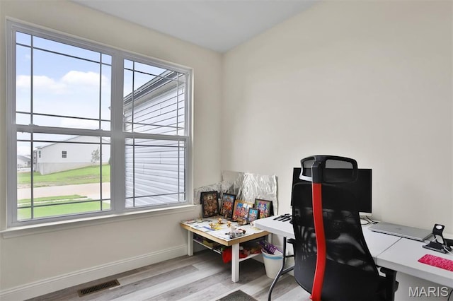 112 Westhaven View Dr, Wentzville, MO 63385 - home office with plenty of natural light, wood finished floors, and baseboards