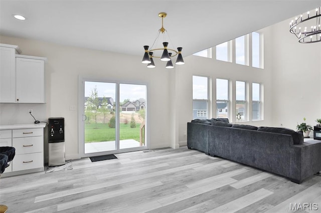112 Westhaven View Dr, Wentzville, MO 63385 - living room with a chandelier, healthy amount of natural light, light wood-style floors, and recessed lighting