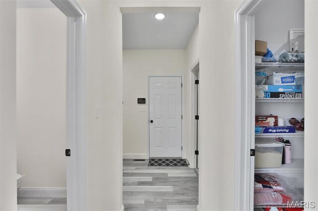 112 Westhaven View Dr, Wentzville, MO 63385 - corridor featuring wood finished floors and baseboards