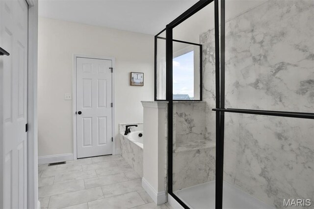 112 Westhaven View Dr, Wentzville, MO 63385 - full bath featuring a marble finish shower, a bath, and baseboards