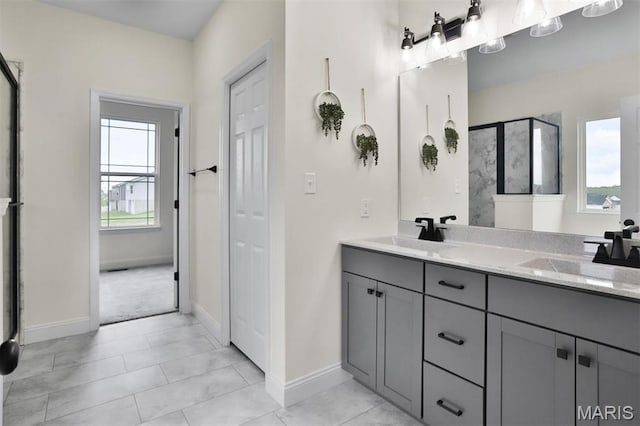 112 Westhaven View Dr, Wentzville, MO 63385 - bathroom with a shower stall, baseboards, and double vanity