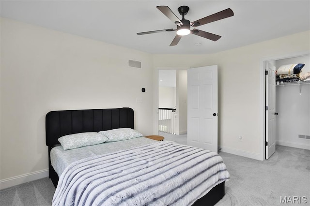 112 Westhaven View Dr, Wentzville, MO 63385 - bedroom featuring light colored carpet, baseboards, a ceiling fan, and a spacious closet