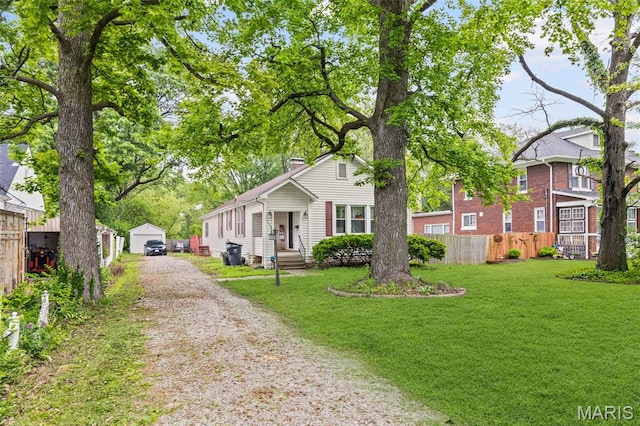 113 Orchard Dr, Belleville, IL 62221 - view of front of property featuring a chimney, driveway, and an outdoor structure