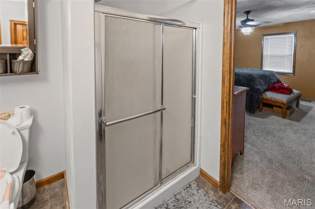 113 Orchard Dr, Belleville, IL 62221 - bathroom with a stall shower, baseboards, toilet, and connected bathroom