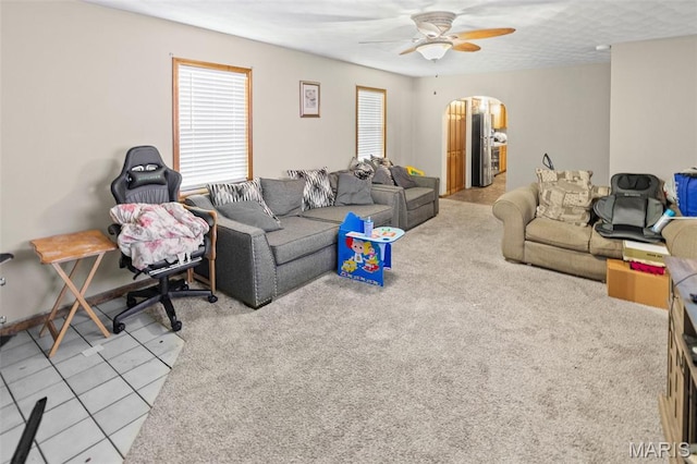 113 Orchard Dr, Belleville, IL 62221 - tiled living room featuring a ceiling fan and arched walkways
