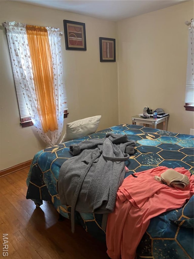 7401 Pleaseway Dr, Saint Louis, MO 63136 - bedroom with wood finished floors and baseboards