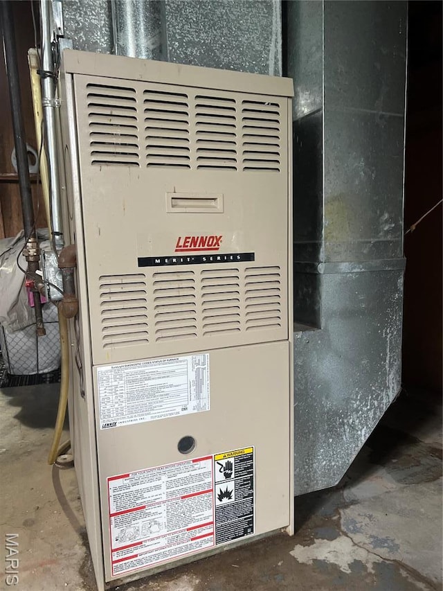 7401 Pleaseway Dr, Saint Louis, MO 63136 - utility room with heating unit