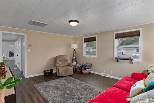 living area featuring wood finished floors and baseboards