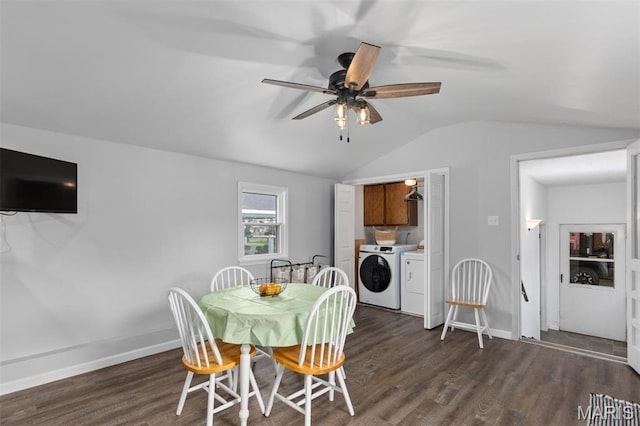 dining space featuring separate washer and dryer, vaulted ceiling, dark wood-style floors, a ceiling fan, and baseboards