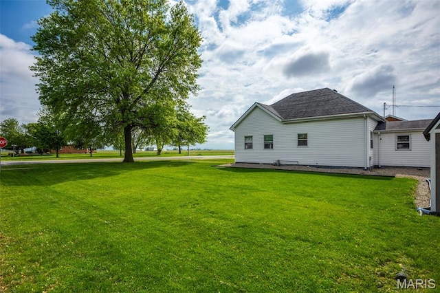 rear view of property with a yard