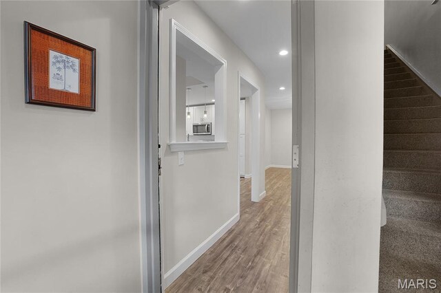 4250 Lindell Blvd Unit A, Saint Louis, MO 63108 - hallway featuring baseboards, stairs, wood finished floors, and recessed lighting