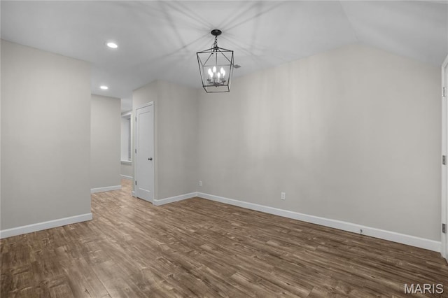 4250 Lindell Blvd Unit A, Saint Louis, MO 63108 - unfurnished dining area with wood finished floors, a chandelier, recessed lighting, baseboards, and vaulted ceiling