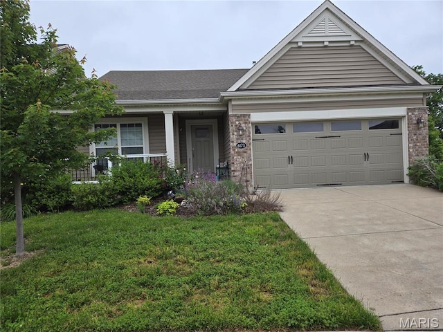 6173 Mackenzie Valley Ct, Saint Louis, MO 63123 - view of front facade with concrete driveway, an attached garage, a front yard, and brick siding