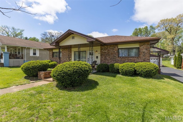 309 S A St, Farmington, MO 63640 - view of front facade with a front yard and brick siding