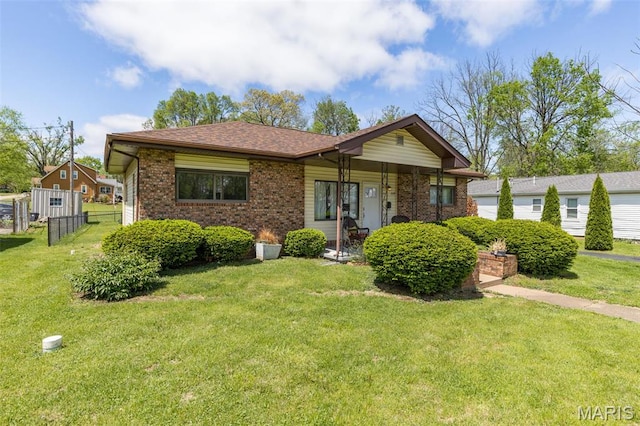 309 S A St, Farmington, MO 63640 - view of front of house featuring brick siding and roof with shingles