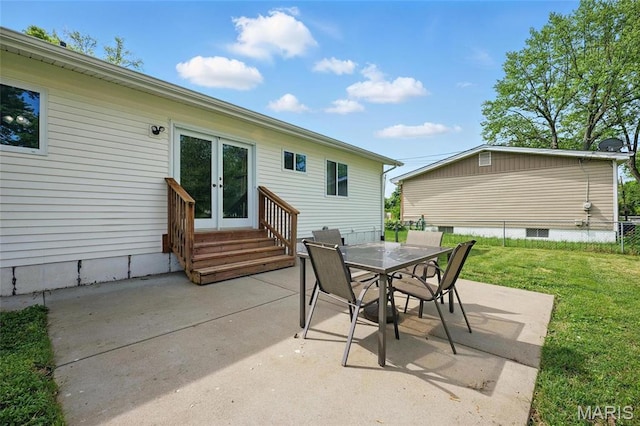 view of patio / terrace with french doors, entry steps, and outdoor dining space