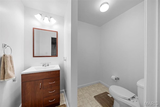 76 Eldorado Dr, Moscow Mills, MO 63362 - half bathroom featuring toilet, vanity, and baseboards