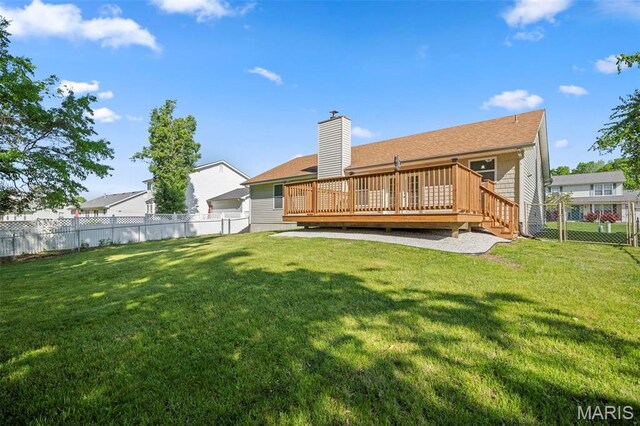76 Eldorado Dr, Moscow Mills, MO 63362 - rear view of house with a chimney, a wooden deck, and a shingled roof