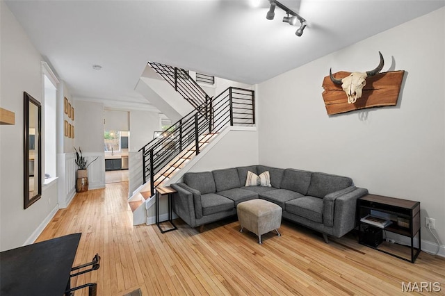 2005 Arsenal St, Saint Louis, MO 63118 - living area featuring stairway, light wood-type flooring, and baseboards