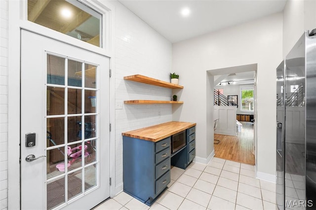 2005 Arsenal St, Saint Louis, MO 63118 - doorway with light tile patterned flooring and baseboards