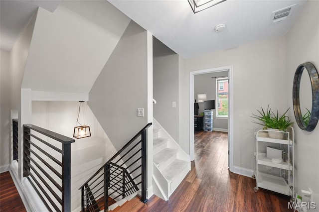 2005 Arsenal St, Saint Louis, MO 63118 - stairs featuring wood finished floors and baseboards