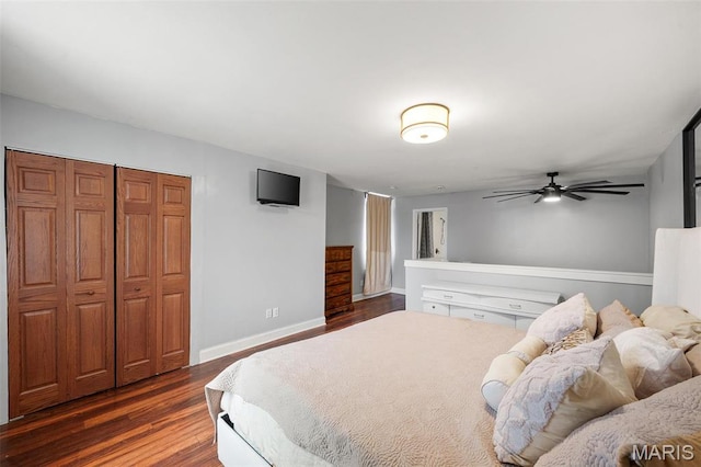 2005 Arsenal St, Saint Louis, MO 63118 - bedroom with dark wood-style flooring, baseboards, and a closet