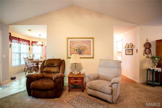 1014 Pine St, Sikeston, MO 63801 - living area with lofted ceiling, carpet floors, baseboards, and a chandelier