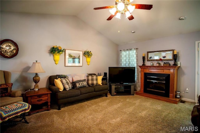 1014 Pine St, Sikeston, MO 63801 - carpeted living area featuring a ceiling fan, vaulted ceiling, and a glass covered fireplace