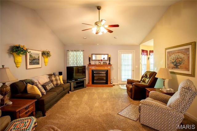 1014 Pine St, Sikeston, MO 63801 - carpeted living room with ceiling fan, high vaulted ceiling, a glass covered fireplace, and baseboards