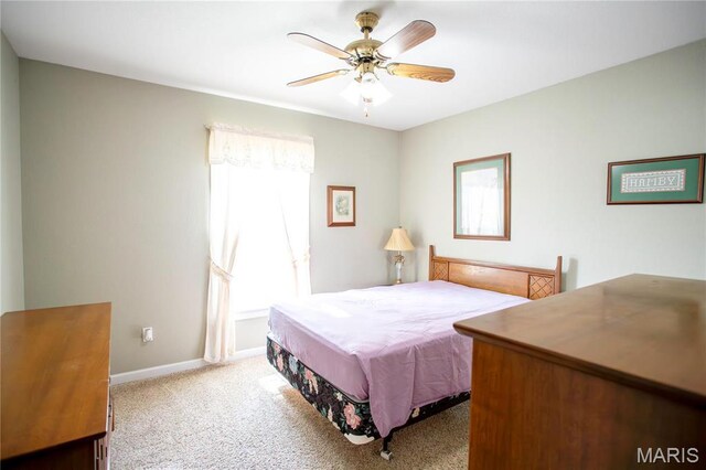 1014 Pine St, Sikeston, MO 63801 - carpeted bedroom featuring ceiling fan and baseboards