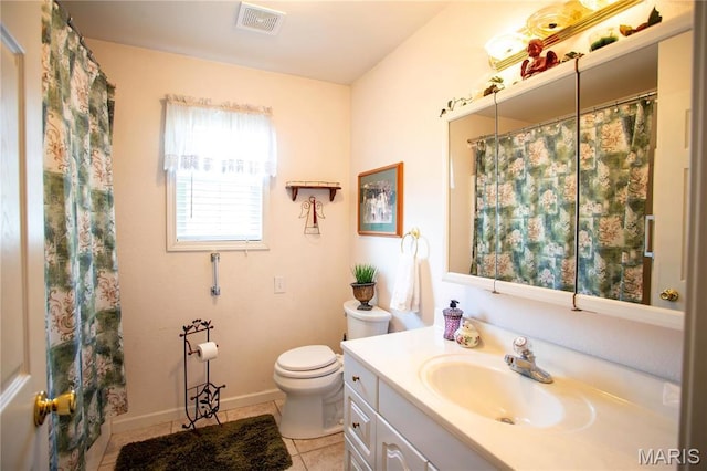1014 Pine St, Sikeston, MO 63801 - bathroom featuring tile patterned flooring, toilet, vanity, baseboards, and curtained shower