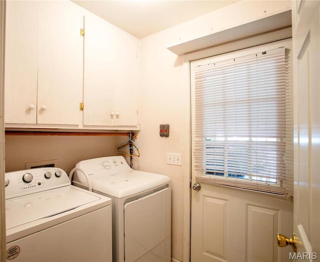 1014 Pine St, Sikeston, MO 63801 - laundry room featuring washing machine and clothes dryer and cabinet space