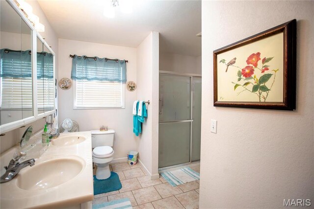 1014 Pine St, Sikeston, MO 63801 - full bathroom with a shower stall, toilet, baseboards, tile patterned floors, and double vanity