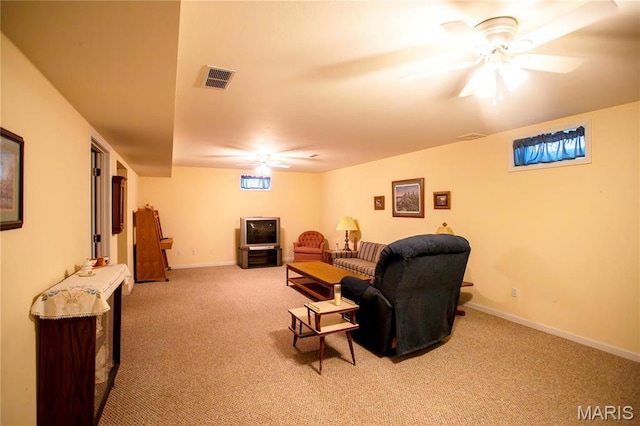 1014 Pine St, Sikeston, MO 63801 - living room featuring carpet, baseboards, and a ceiling fan