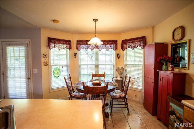 1014 Pine St, Sikeston, MO 63801 - dining space featuring plenty of natural light and light tile patterned floors