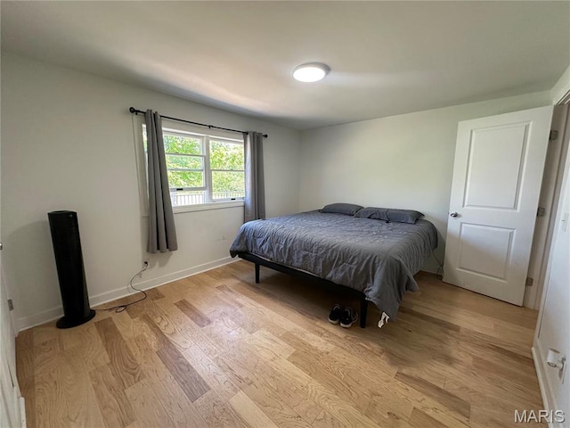 17260 Carver Dr, New London, MO 63459 - bedroom with light wood-type flooring and baseboards