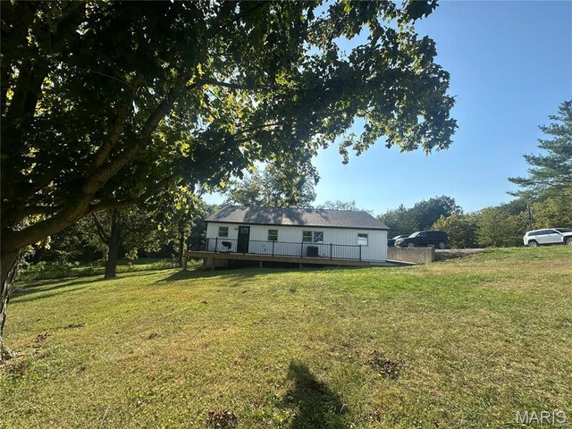 17260 Carver Dr, New London, MO 63459 - view of front facade featuring a deck and a front yard