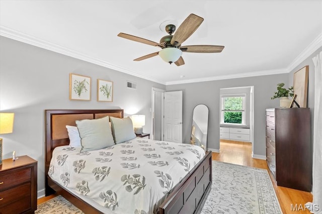 bedroom with light wood-style flooring, crown molding, baseboards, and ceiling fan