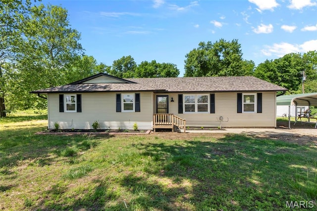 2047 State Highway H, Sikeston, MO 63801 - ranch-style home featuring a front lawn and a detached carport
