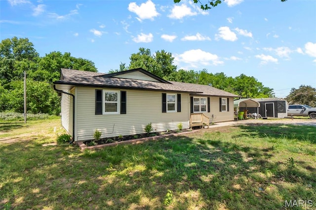 2047 State Highway H, Sikeston, MO 63801 - ranch-style house with a front lawn and a shingled roof