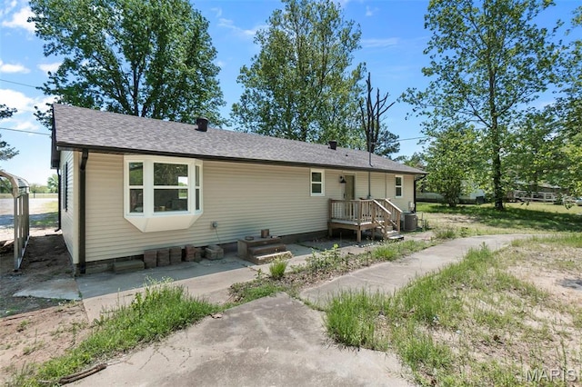 2047 State Highway H, Sikeston, MO 63801 - back of property with central AC and roof with shingles
