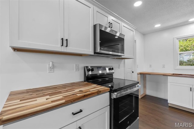 2047 State Highway H, Sikeston, MO 63801 - kitchen with stainless steel appliances, butcher block countertops, recessed lighting, white cabinetry, and dark wood-style flooring