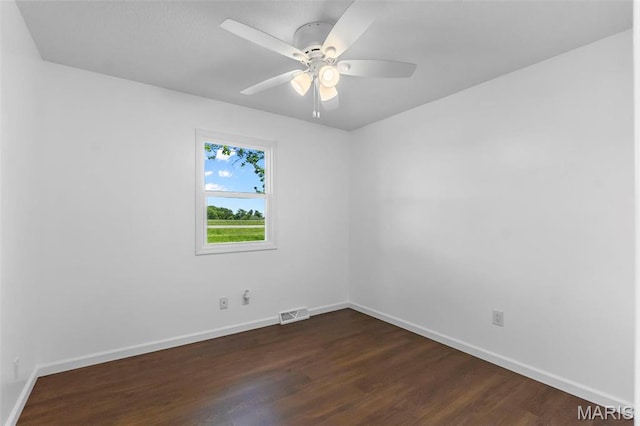 2047 State Highway H, Sikeston, MO 63801 - empty room featuring dark wood-style flooring, baseboards, and a ceiling fan