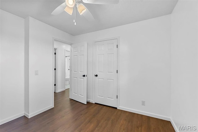 2047 State Highway H, Sikeston, MO 63801 - unfurnished bedroom with baseboards, dark wood-type flooring, and ceiling fan