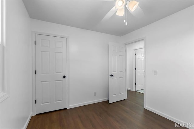 2047 State Highway H, Sikeston, MO 63801 - unfurnished bedroom featuring dark wood-style floors, baseboards, and ceiling fan