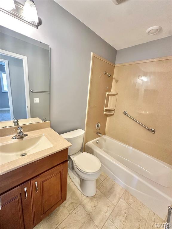 2944 Advance Dr, Florissant, MO 63031 - full bath with vanity, toilet, and washtub / shower combination