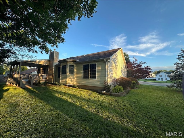 511 Log Cabin Rd, Farmington, MO 63640 - back of property with a chimney and a yard